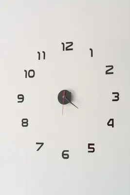 a clock on a wall with numbers on it at Entire, spacious, spotless apartment, in Ilioupoli, Greece in Athens