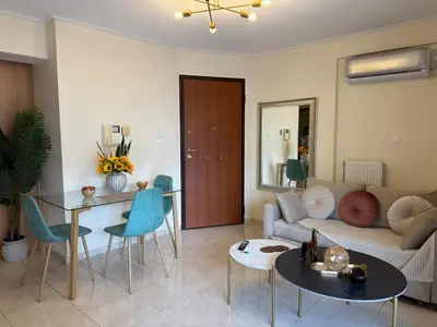 a living room with a couch and a table at Acropolis Calm Escape-Central 2 min from the metro in Athens
