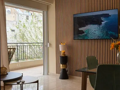 a living room with a view of the ocean at Acropolis Calm Escape-Central 2 min from the metro in Athens