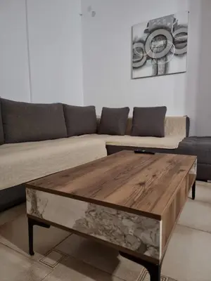 a living room with a couch and a coffee table at from Space to well-Designed COMFY in Piraeus