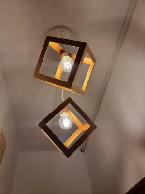 three lights on the ceiling of a room at from Space to well-Designed COMFY in Piraeus