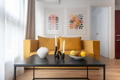 a living room with a table with a bowl of fruit at Praxitelous Hideout in Athens