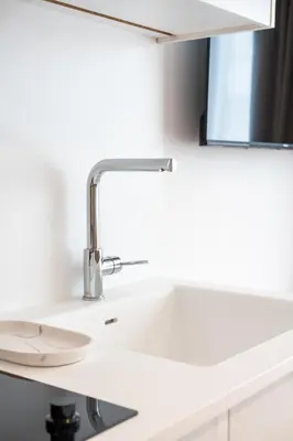 a bathroom sink with a mirror above it at Praxitelous Hideout in Athens
