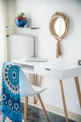 a white desk with a chair and a mirror at Comfortable two bedroom Athens appartment - Sando in Athens