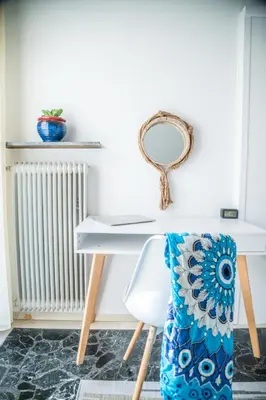 a white desk with a chair and a mirror at Comfortable two bedroom Athens appartment - Sando in Athens