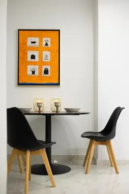 a dining room with two chairs and a table at Artistic Stay in the Heart of Athens in Athens