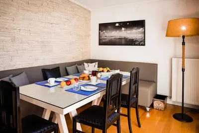 a dining room with a table with fruit on it at South Blue Tranquil Villa in Athens