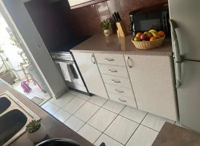 an overhead view of a kitchen with a sink and a refrigerator at Luxury apt in Pagkrati in Athens