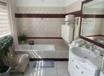 a bathroom with a tub and a sink at Luxury apt in Pagkrati in Athens