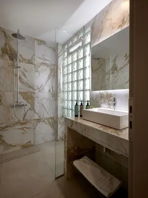 a bathroom with a sink and a mirror at Athens City Suites in Athens