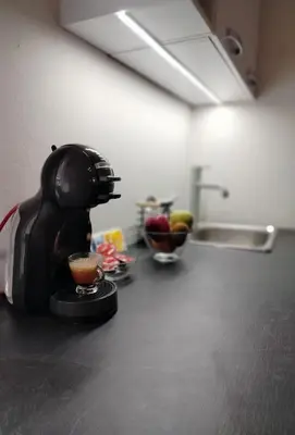 a coffee maker sitting on a counter in a kitchen at Olive apartment in Paianía