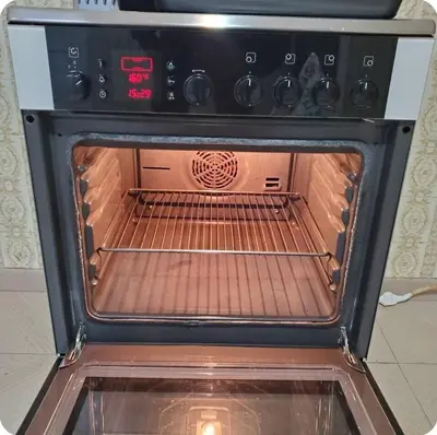 an oven with its door open in a kitchen at Home away from home - 3BR - 14' walk to port in Piraeus