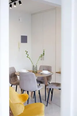 a dining room with a table and chairs at Modern 2-Bedroom Apartment in Downtown Glyfada in Athens