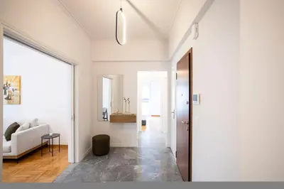 a hallway of a house with a living room at Elegant 3-Bedroom Retreat in the Heart of Kolonaki in Athens