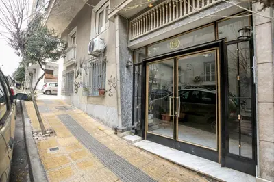 a store front with glass doors on a city street at Selesta - Stylish 2 Bedroom Apartment in Athens in Athens