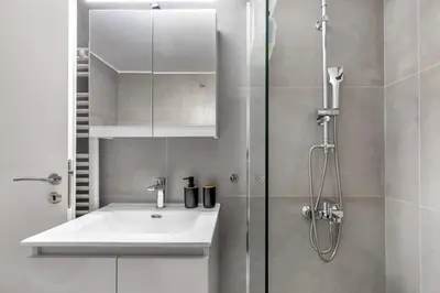 a bathroom with a sink and a shower at Selesta - Stylish 2 Bedroom Apartment in Athens in Athens