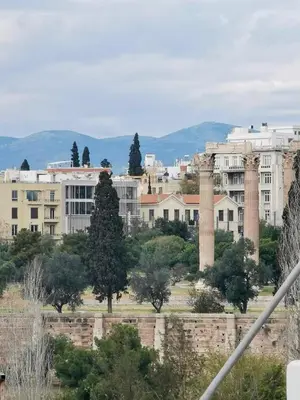 a view of a city with columns and buildings at Temple of Zeus 3BD Apartment in Athens