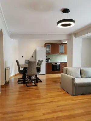 a living room with a couch and a table at Temple of Zeus 3BD Apartment in Athens