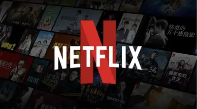 a bunch of movies on a wall with the word n netflix at Terminal Square Suites in Markopoulo