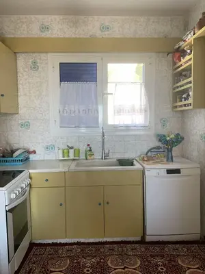 a kitchen with a sink and a window at Blue Echoes in Saronida