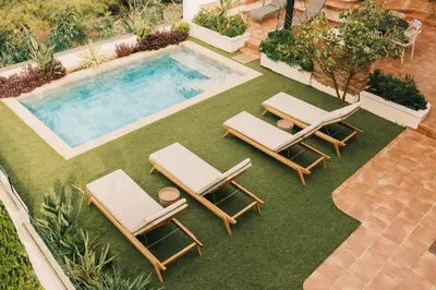 an overhead view of two lounge chairs and a swimming pool at Villa Calma by A&D Properties in Porto Rafti