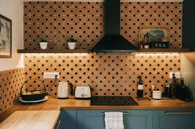 a kitchen with a stove and a wall with hearts at Villa Calma by A&D Properties in Porto Rafti