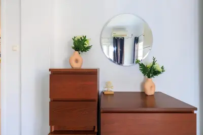 a mirror on top of a dresser in a room at AIOLOS Glyfada LUX Escape suite 6 in Athens