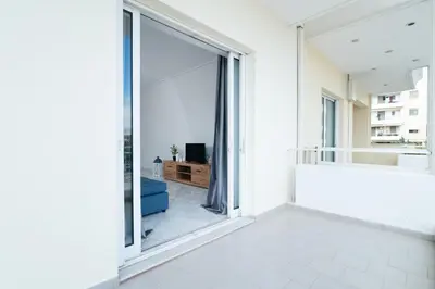 a bathroom with a large window and a tub at The Sunrise Apartment By Athens Airport 1 in Spáta