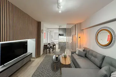 a living room with a couch and a table at Classy Athens Retreat near Downtown in Athens