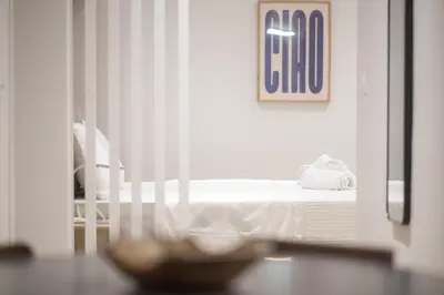 a room with a bed and a table with a mirror at Classy Athens Retreat near Downtown in Athens
