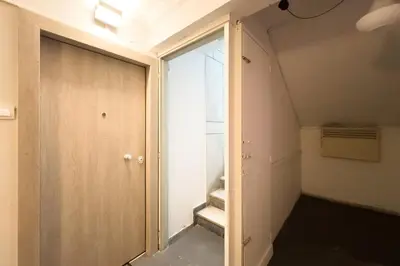 a room with a sliding door and a staircase at Classy Athens Retreat near Downtown in Athens