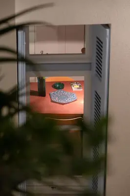 a close up of a television with a table at Athenian Cypress House, Atelier in Athens