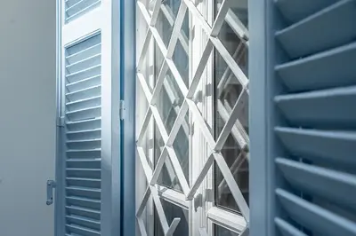 a glass door of a building with a window at Athenian Cypress House, Maisonette in Athens
