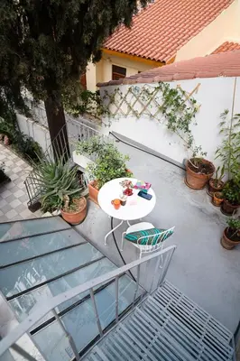 an overhead view of a patio with a table and chairs at Athenian Cypress House, Maisonette in Athens