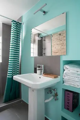 a bathroom with a white sink and a mirror at Athenian Cypress House, Maisonette in Athens