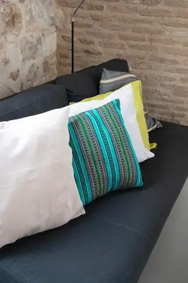 a group of pillows sitting on a couch at Athenian Cypress House, Maisonette in Athens