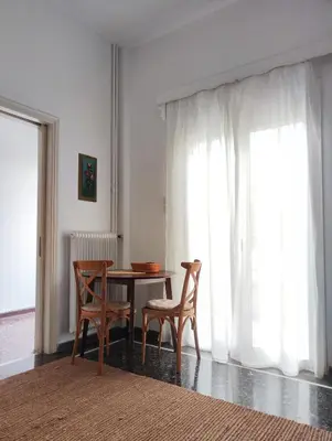 a dining room with a table and two chairs at Casa Lula in Athens