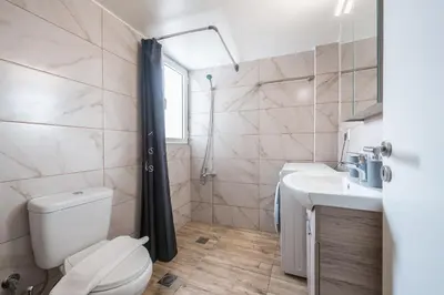 a bathroom with a toilet and a sink at Ble Elia Flat for two in Athens in Athens