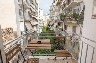 a balcony with a table and chairs on it at Ble Elia Flat for two in Athens in Athens
