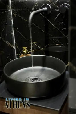 a bathroom sink with water coming out of it at Eugene's Deluxe Athenian apt 4ppl 5 min wd Metro in Athens