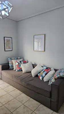 a large bed in a room with pillows on it at Casa Geli l Comfort meets charm, centrally located in Athens