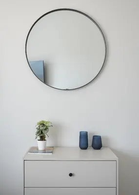 a white dresser with a mirror on a white wall at Athens Luxury Ethereal View in Athens