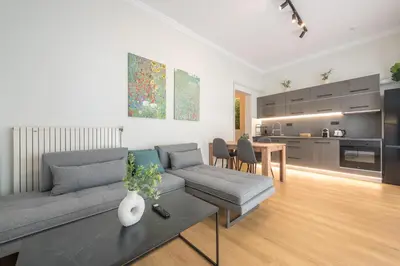 a living room with a couch and a table at Platon At Philopappou By Greece Apartments in Athens