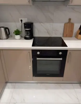 a kitchen with a black stove top oven at Amazing Apt with 2 Bedrooms in Pagkrati in Athens