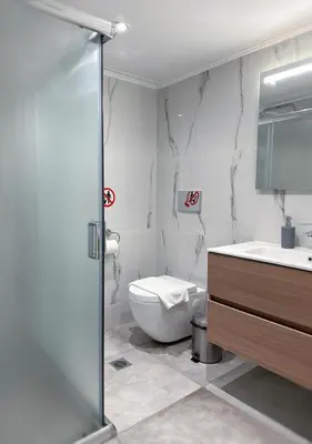 a bathroom with a toilet and a sink at Glyfada Sea Breeze Loft A in Athens