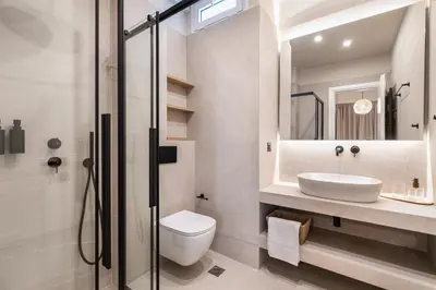 a bathroom with a toilet sink and a shower at Syntagma Acropolis View Residence in Athens