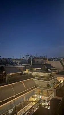 a view of a large building with lights on at Cosy Apartment in the Heart of Athens in Athens