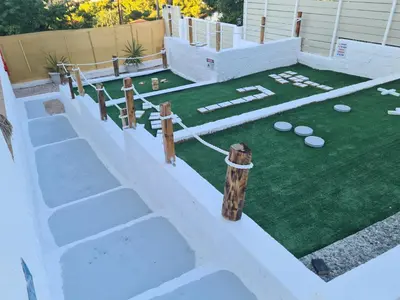 a backyard with a landscaping project with a golf course at Sea View Hill House in Porto Rafti