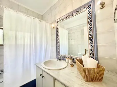 a bathroom with a sink and a mirror at Zen house in Athenian Riviera in Athens