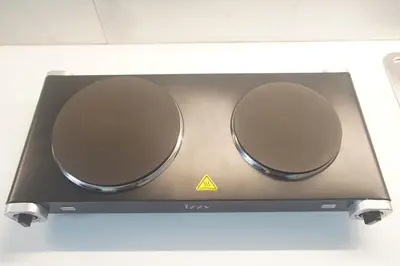 a stove top with two speakers on top of it at Cozy Apartment Downtown Athens III in Athens